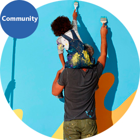 Community - man and boy painting a wall
