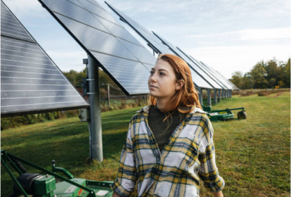 Woman in from of solar panels