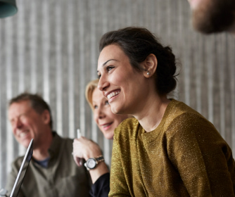 Woman smiling with coworkers