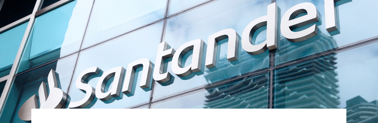 Santander Bank logo on the front of a glass building
