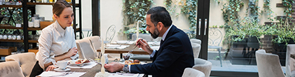 Woman and Man Business Lunch in Restaurant