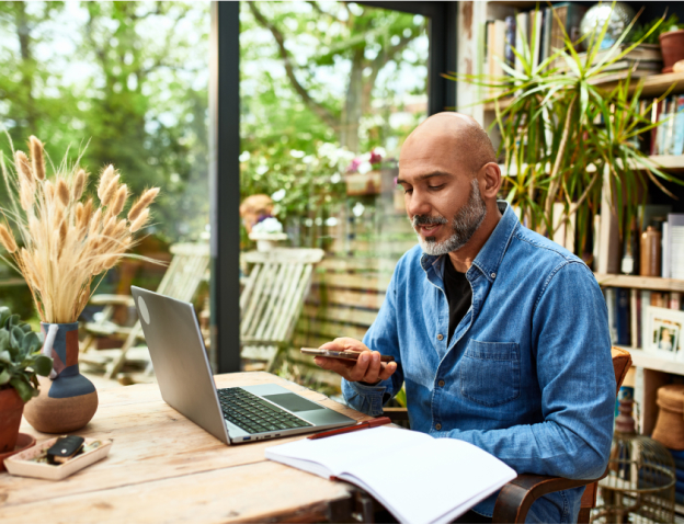 A man working in front of a laptop