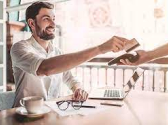 Man paying for coffee with a credit card.