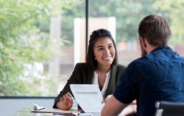 Banker at desk with a client