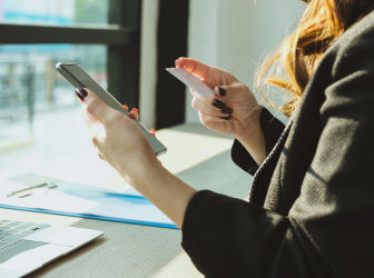 a woman holding a phone