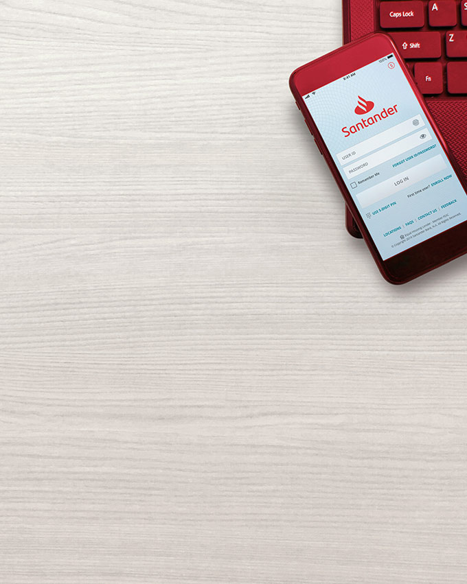 A customer logging into the Santander Mobile Banking App on their smartphone.