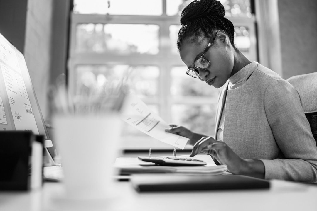 Image of a woman preparing tax documents